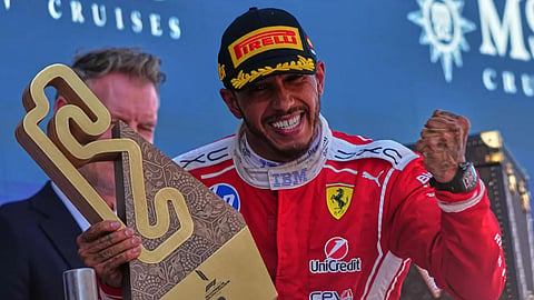 Ferrari driver Lewis Hamilton of Britain celebrates after wining the Spain F1 Grand Prix race at the Barcelona Catalunya racetrack in Montmelo, near Barcelona