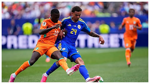 Ivory Coast's Nicolas Pepe (19) and Curaçao's Deveron Fonville (24) fight for the ball during the World Cup Group E soccer match between Curacao and Ivory Coast in Philadelphia