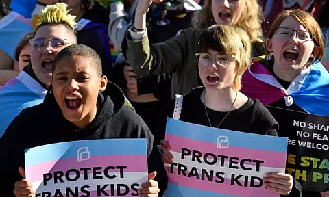 &nbsp;Protesters of Kentucky Senate Bill SB150, known as the Transgender Health Bill, cheer on speakers during a rally on the lawn of the Kentucky Capitol in Frankfort, Ky., March 29, 2023. A federal judge temporarily blocked Kentucky’s ban on gender-affirming care for transgender youths on Wednesday, June 28, taking the action shortly before the measure was set to take effect.(Photo: AP)
