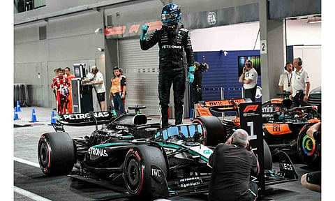 &nbsp;George Russell stands on his car as he celebrates getting pole position&nbsp;
&nbsp;