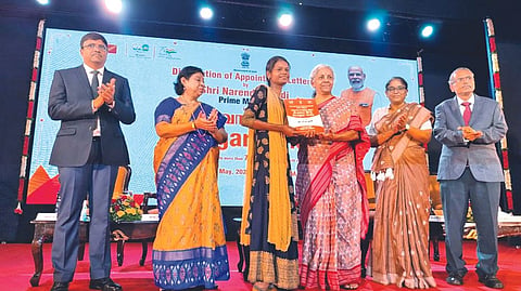 Union Finance Minister Nirmala Sitharaman handing over a job offer to one of the beneficiaries of Rozgar Mela at a function in Chennai on Tuesday